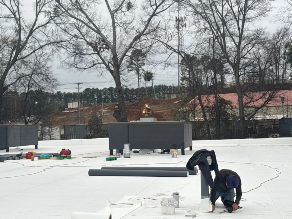 MDJ crew heat-welding TPO details on a commercial roof